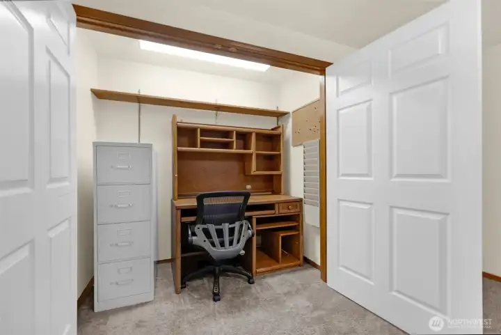 Home office in oversized closet in family room. Desk, chair & file cabinet convey with sale.
