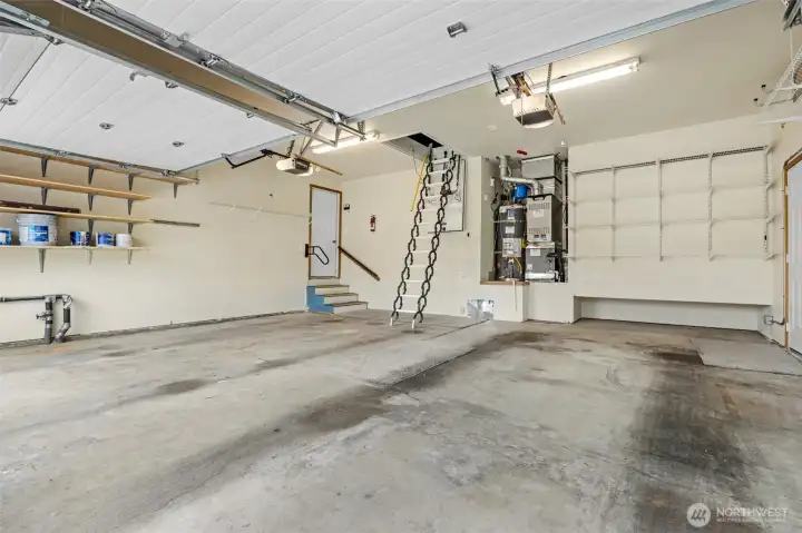 Oversized 2+ car garage with attic storage. Ladder/stairs are automatic with remote.