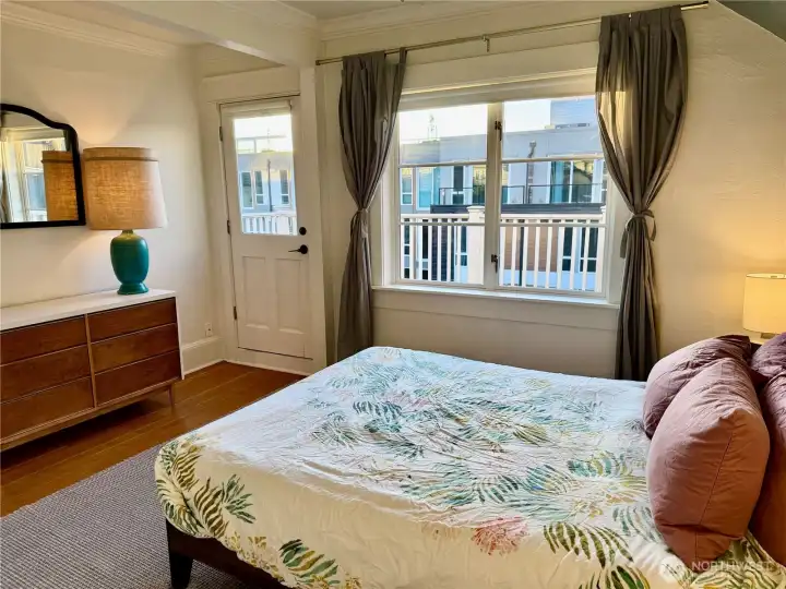 Primary bedroom upstairs with spacious deck.