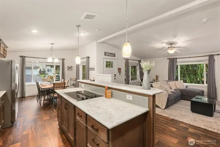 Kitchen positioned at the center of the home with clear views into both living and dining spaces.