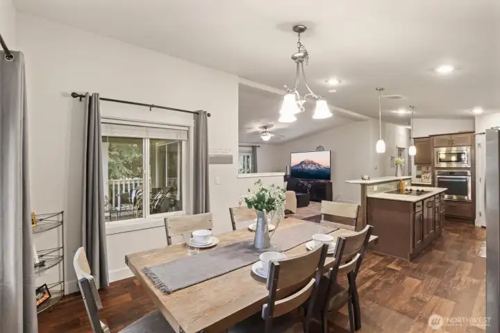 Open layout connecting dining, kitchen, and living areas for seamless flow.