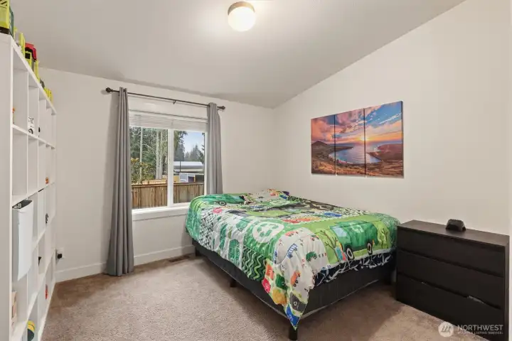 Additional bedroom with natural light and adaptable layout for a variety of needs.