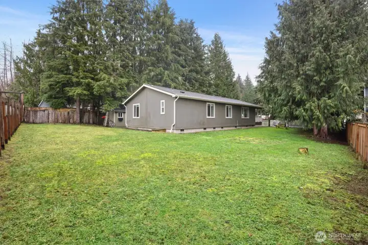 Large, open backyard with room for entertaining, play, or future improvements.