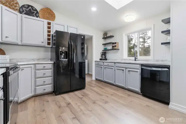 Utility room and back door is located just off the kitchen.