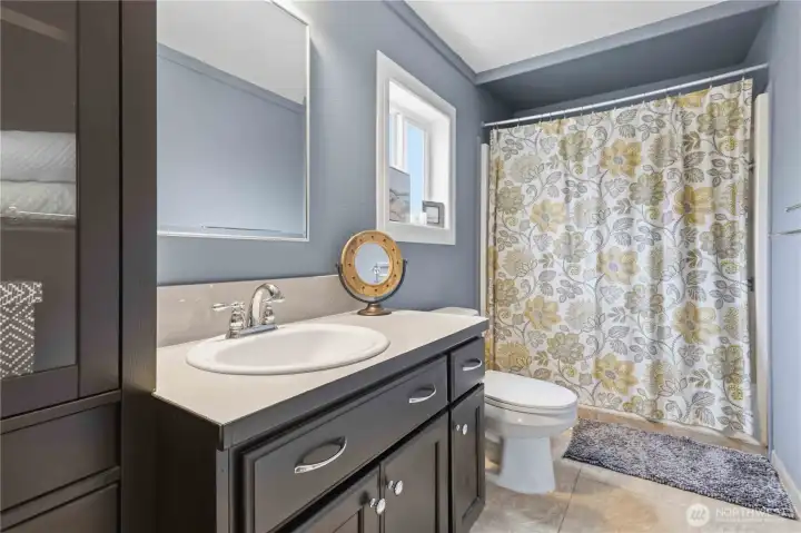 En suite bathroom off of the primary bedroom.