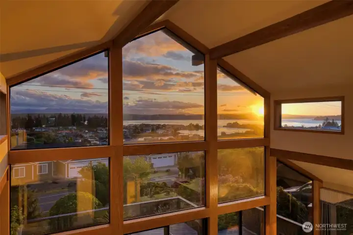 Soaring ceilings and walls of windows bring in expansive views of the glittering waters of Hood Canal. Soaring ceilings and walls of windows bring in expansive views of the glittering waters of Hood Canal.