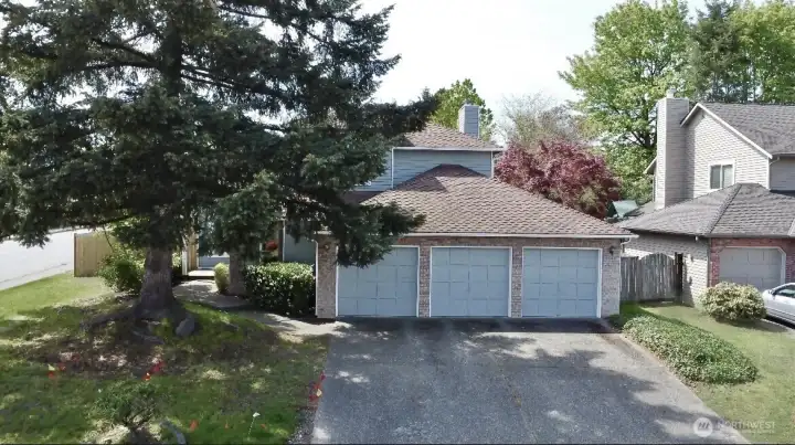 3 car garage and long driveway