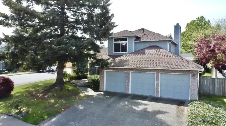 3 car garage and long driveway
