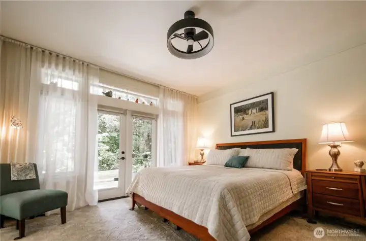 Primary bedroom with French doors out to the covered patio!