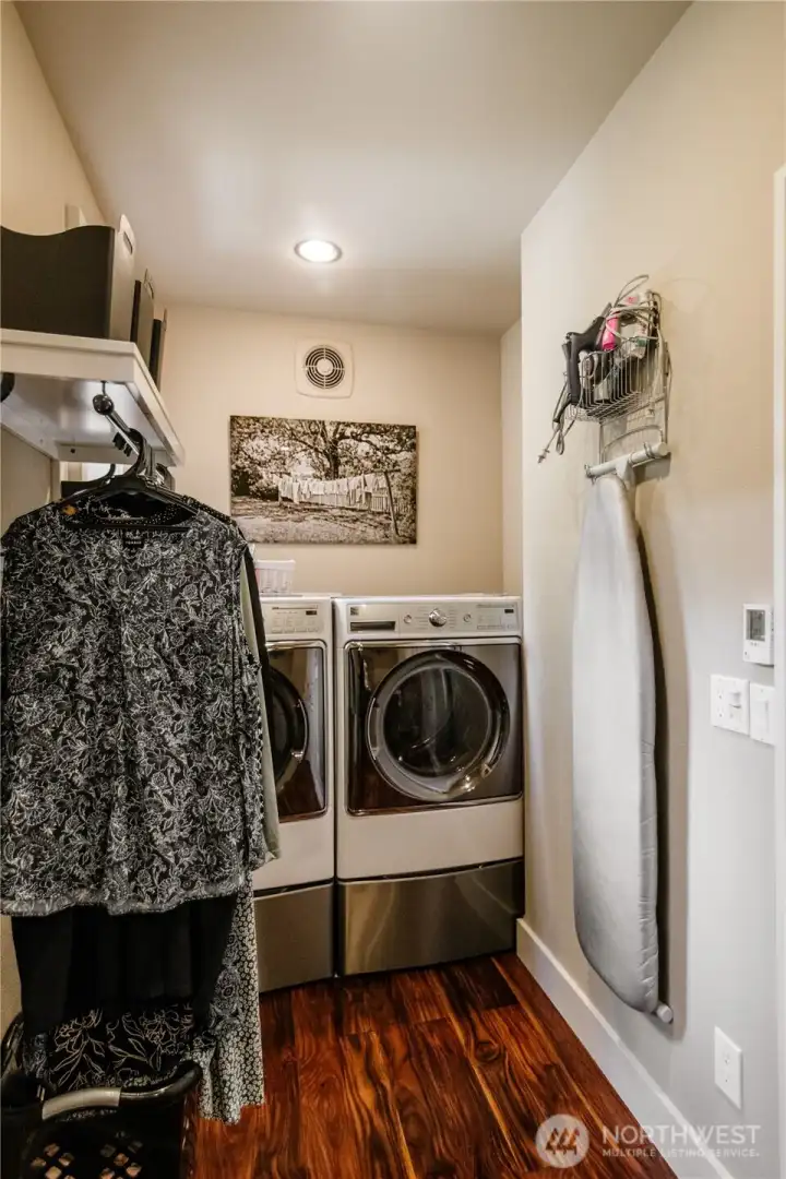 Ensuite laundry between the primary bath and closet.