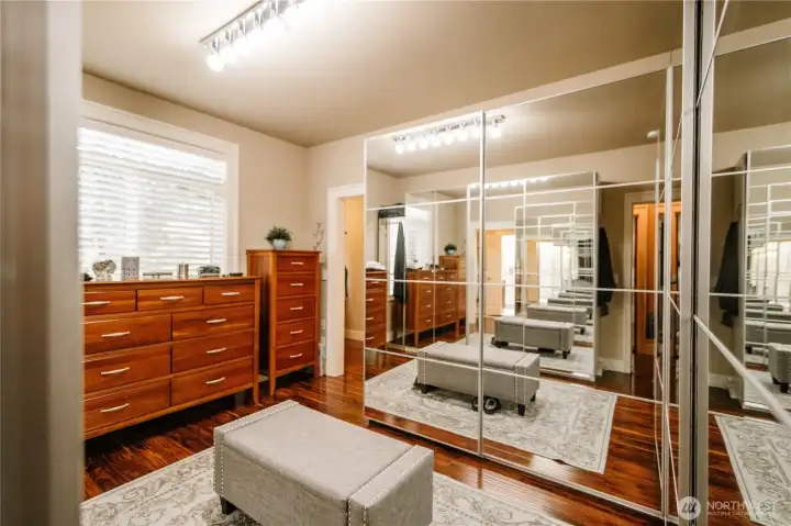 A bedroom was converted into a GIANT closet with custom units that light up when you open the doors!
