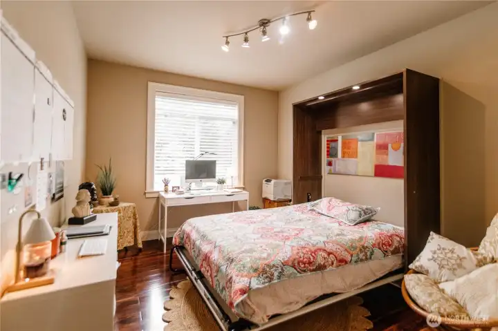 Office and guest bedroom with this convenient murphy bed, which stays with the house.