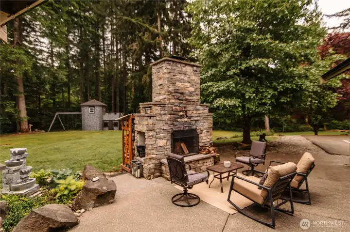 Custom outdoor fireplace is stunning!