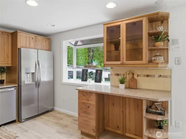 Sunny kitchen with terrarium window.