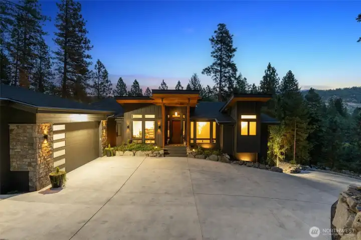 Designed for the elite outdoor enthusiast, this mountain modern estate is the ultimate escape from the city, blending high-end sophistication with world-class high-end tech features. Experience a seamless luxury lifestyle powered by a fully integrated Smart Home system, featuring automated climate and lighting control. With a dedicated, high-speed remote work setup, stay connected while surrounded by soaring ceilings and panoramic forest views. Every corner of this home reflects an absolute attention to every detail, from the artisan finishes to the precision engineering, ensuring a living experience of unparalleled quality.    Features:    Outside   Concrete driveway, lights, wall & house number   Drive faces south, ice melts very quickly in winter   Autel Maxicharger Electric Vehicle (EV) Charger, 240V   External house painted with Sherwin Williams    ? New gutters, leaf guard & heated wires with Hue Smart Plugs Smart Plug - allows for remote   access   3 x Google Nest Cam wired cam