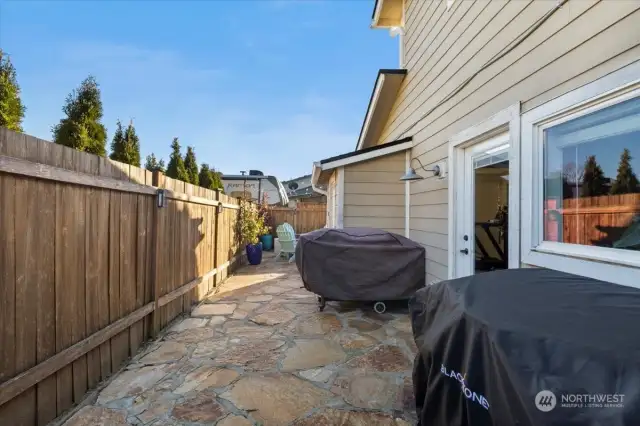 Plenty of room to grill on the back patio! These are 2 full-sized grills