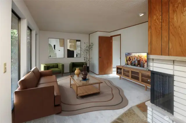 Living room off entryway, slate floor entry, corner gas fireplace, new carpeting and paint. Door in back corner leads to 3rd bedroom