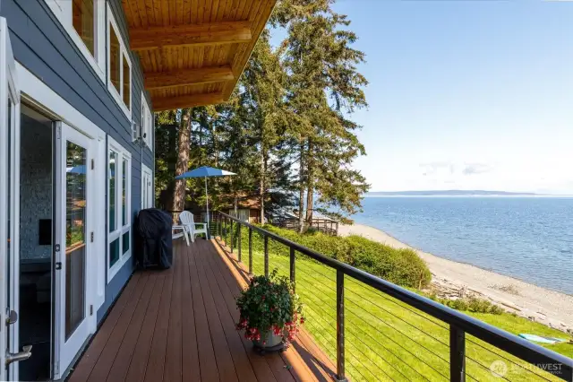 Step outside to your expansive partially covered 60x7’ Trex deck...featuring crystallite railing and adjustable cables and beautiful 180-degree unobstructed views.