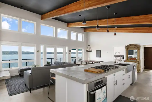 Look at those gorgeous dramatic exposed wood beams! You’ll love the crystal White quartz countertops, soft-close Belmont cabinetry with pull-out shelves, and elegant lighting by Rejuvenation.