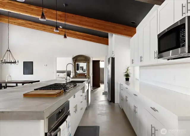 5-burner propane cooktop with downdraft, and a deep freeze for your fresh seafood catches at the far right of counter near fridge.