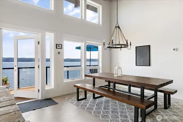 A Pottery Barn chandelier sets the tone for elevated yet relaxed dining experiences in the adjoining dining area. French doors provide easy access to Trex deck with propane barbecue!