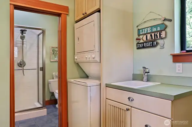 Utility Room with pocket door to a 3/4 bath.