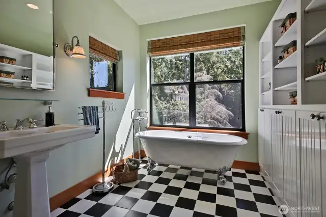 Tile floors, claw tub and walk-in shower. Plenty of built in cabinets for storage.
