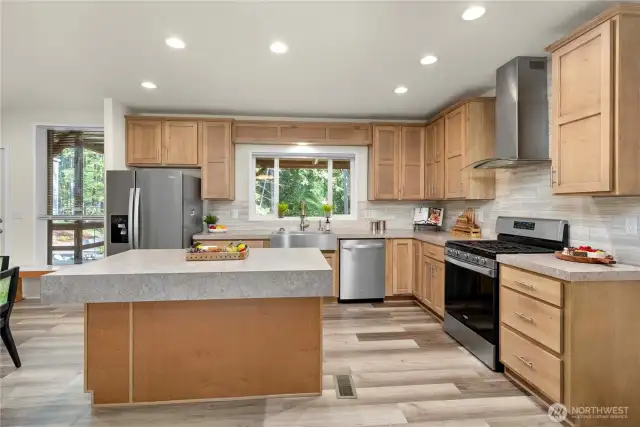 Lots of cabinets, island with bar stool space.