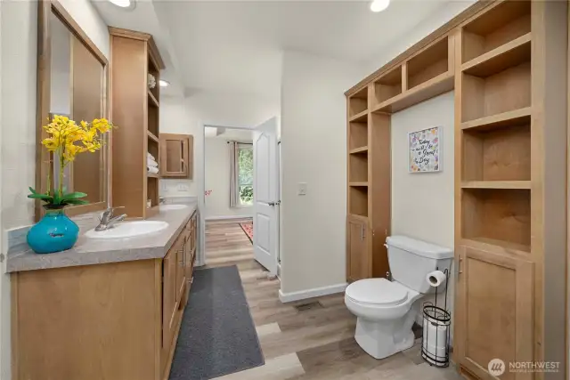 Primary bathroom with 2 sinks, shower with bench seating. Tons of storage.
