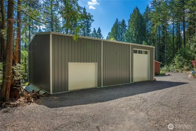 Metal 1500 sq ft shop/garage with RV storage and septic disposal for the RV.