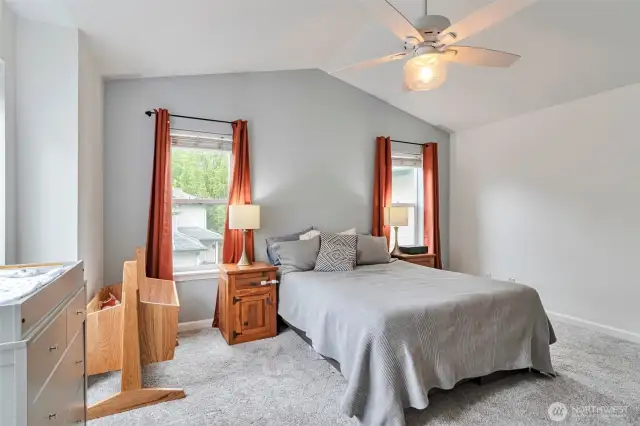 Primary suite w/ vaulted ceilings
