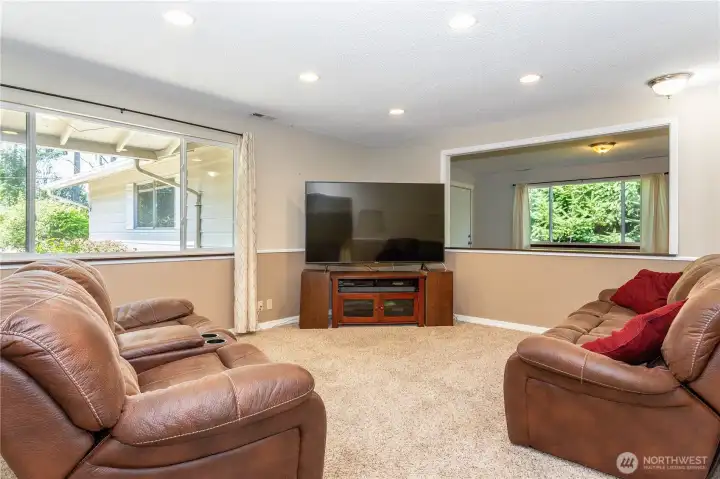 The living room is spacious and accommodates large-scale furniture