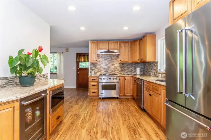 Abundant granite counter space with higher=end appliances. You'll love the natural gas Viking rang & Wolf microwave