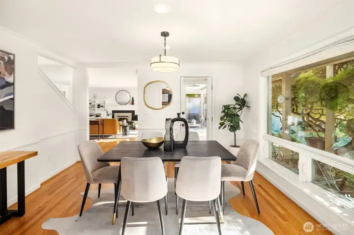 The dining room looks out on the beautiful west facing back yard, and includes a door to the back sitting area.