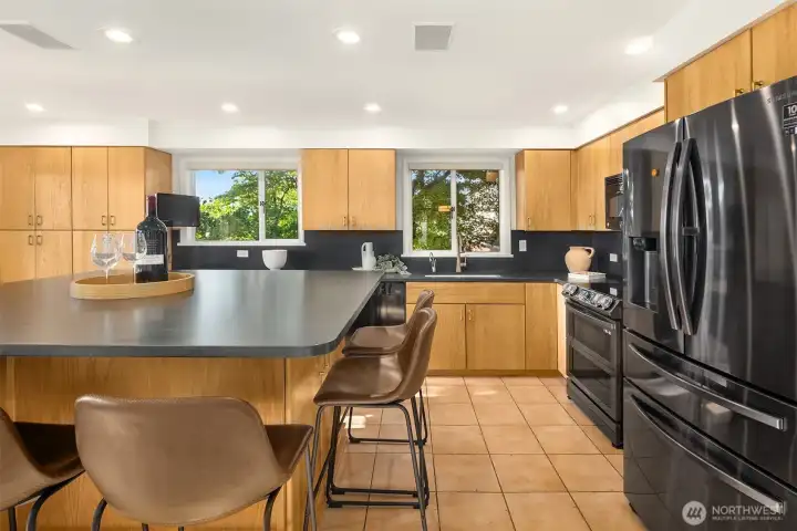 The kitchen boasts lovely new matte granite counters.