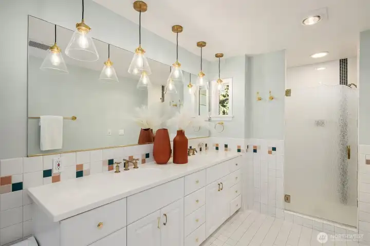 The primary bathroom has double sinks, a jetted shower, separate jetted tub and bidet toilet seat.