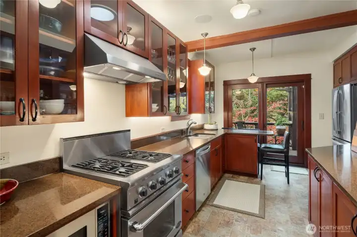 Updated kitchen overlooking lush landscaping