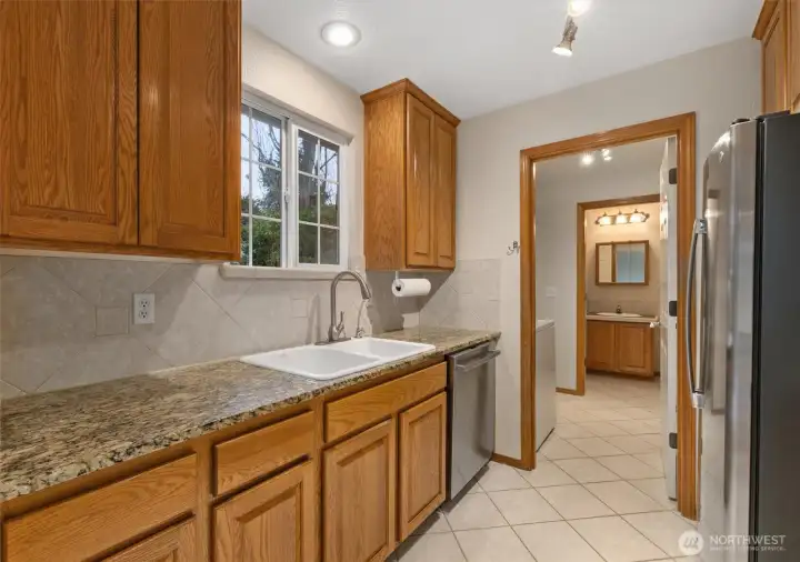 Kitchen has been updated with new granite countertops and recessed lighting.