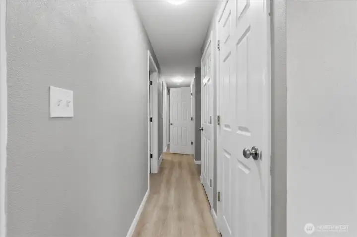 Hallway on main leading to bedrooms and shop area