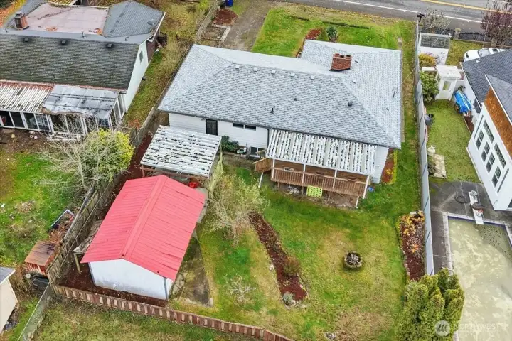 An overview of the property highlighting the back workshop and firepit