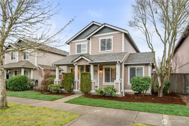 Inviting front porch with fresh new landscaping.