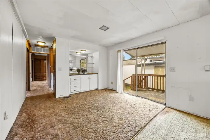 2nd room off kitchen with built in could be craft area, game table for card night, or library/reading room