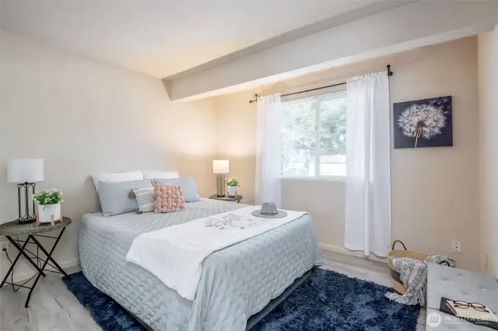 One of the two bedrooms, both have large mirrored closets!