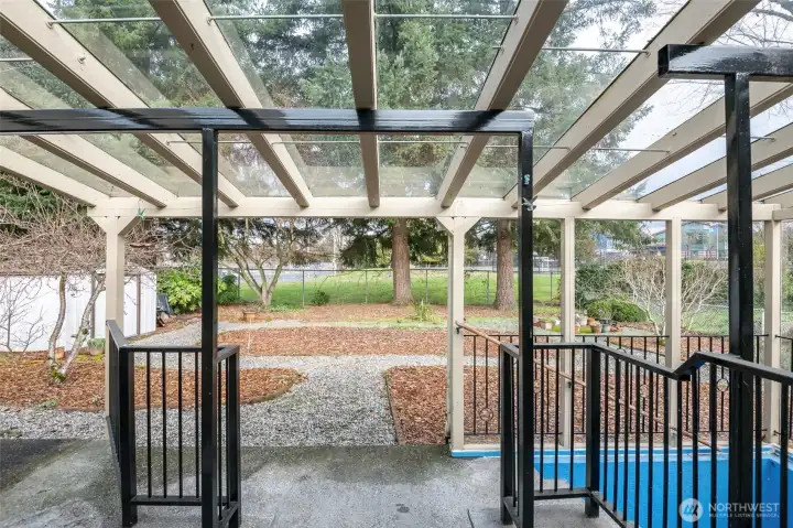 Covered patio to low maintenance backyard.