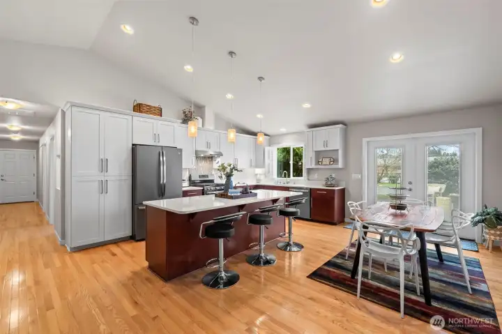 Kitchen boasts ample cabinetry plus extra flexibility for eating and entertaining.