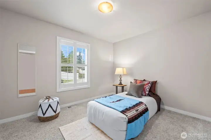 This is first bedroom from entry door from garage.