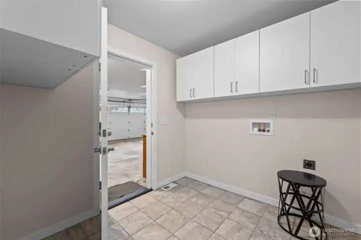 Separate laundry room has its own no-step door leading into garage.