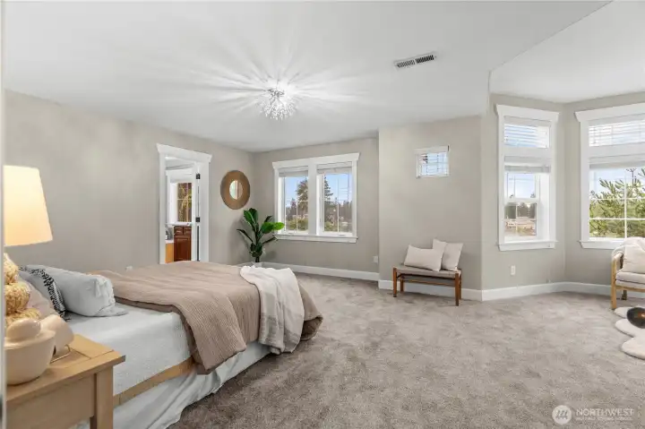 The primary suite upstairs with amazing views of the lake