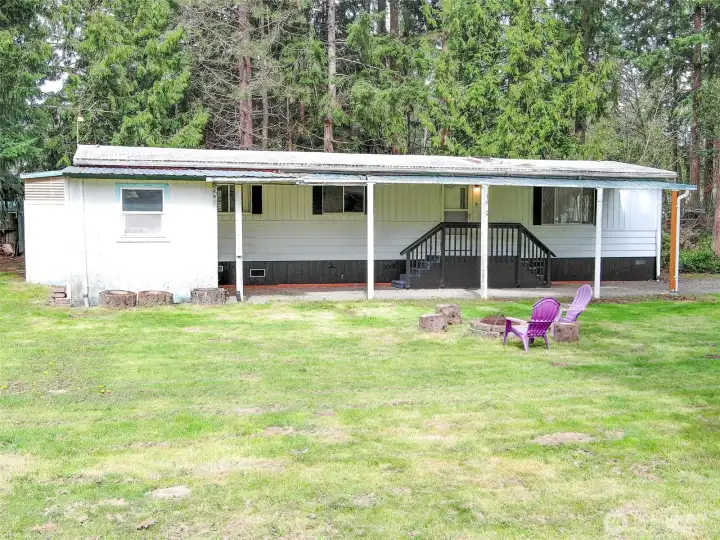 L to R:  shed with door facing the backyard, shop w/ window, and front door.