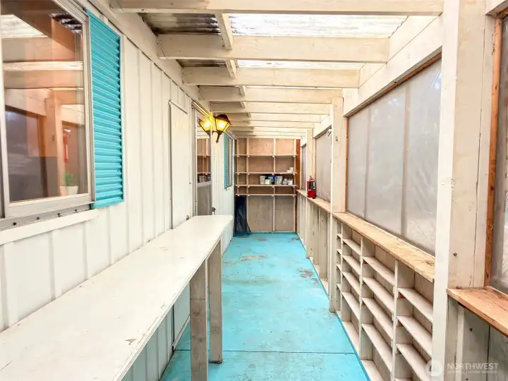 From the door to the outside, looking toward the door back in to the home on the left.